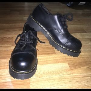 Men’s Dr. Martens steel toe shoes.